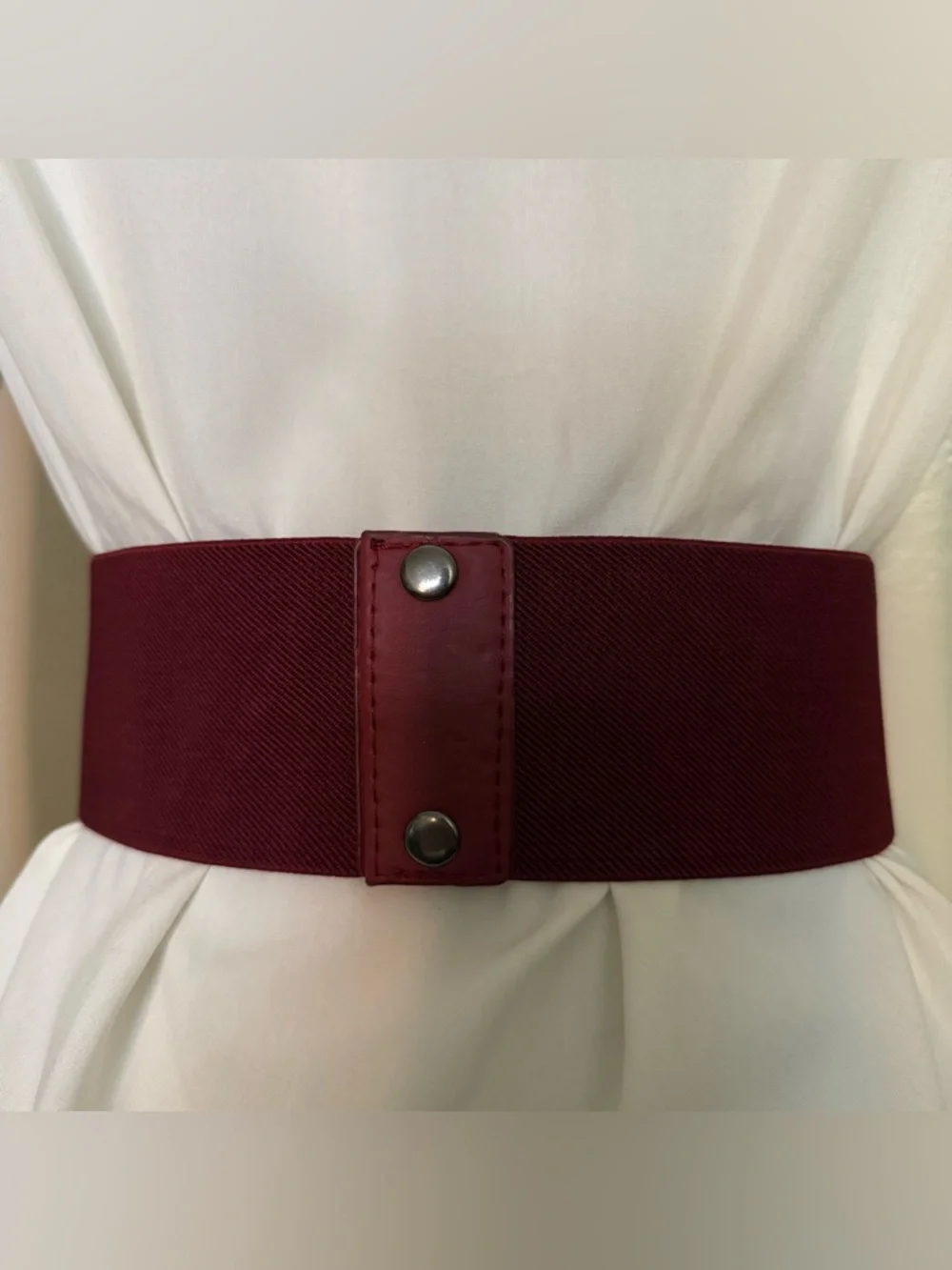 Burgundy elastic waistband belt with brass tone details